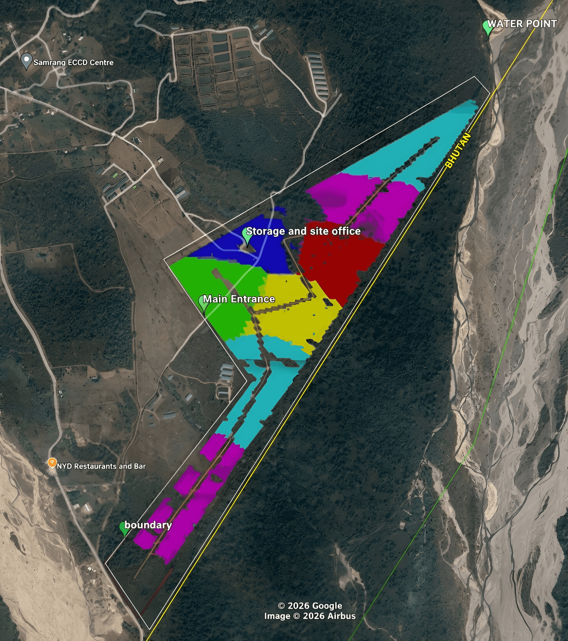 Samrang project landscape with forest, wide riverbed, green-roof buildings, and access tracks.